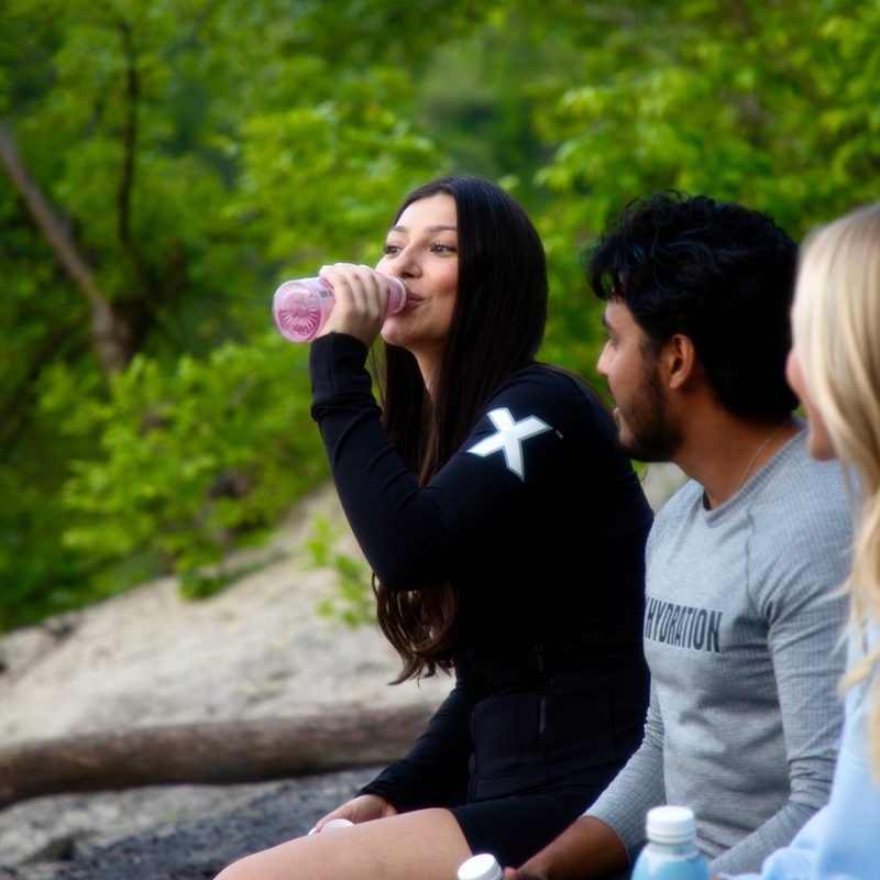 Friends by the lake with X Hydration