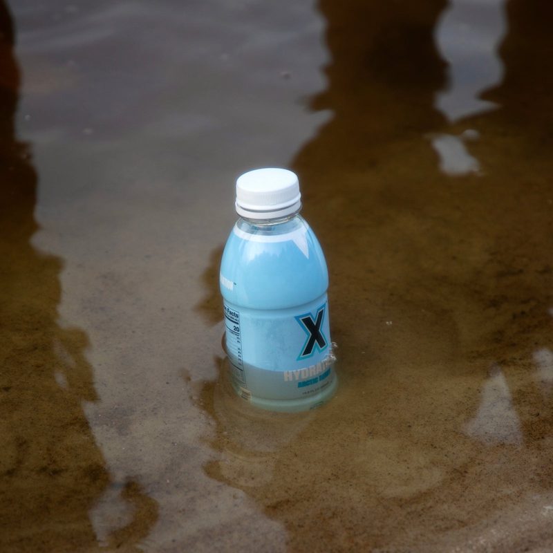 Arctic Berry® bottle in the water